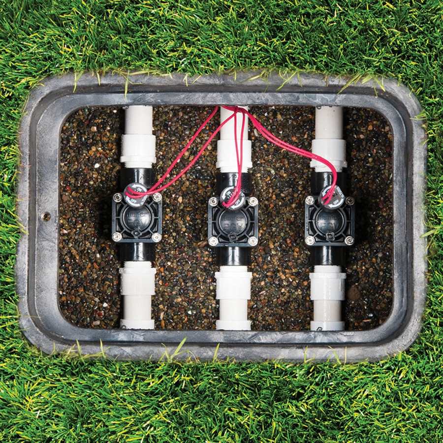 Valve box opened to show three valves and their wiring