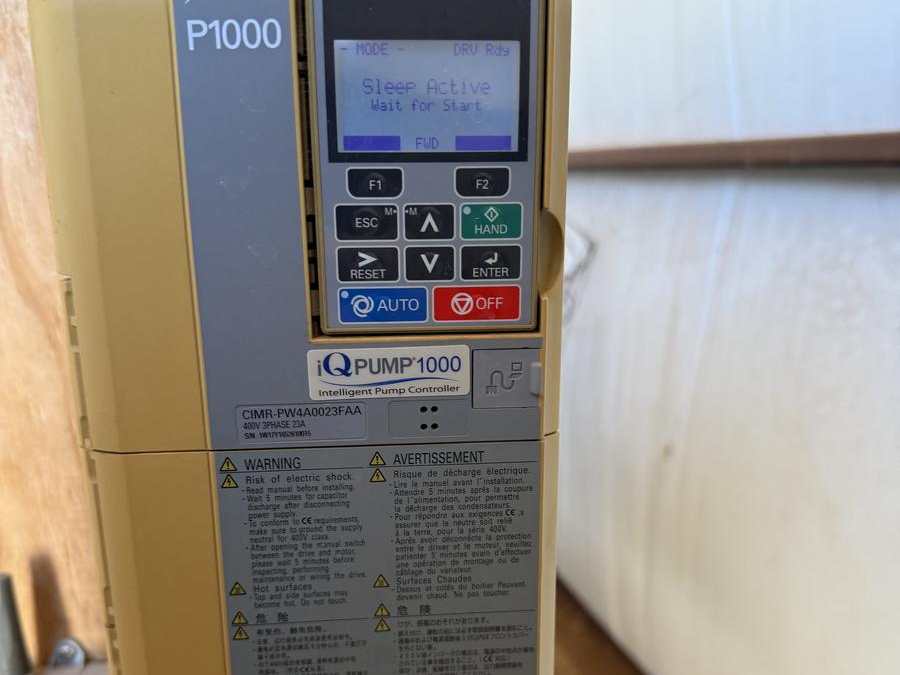 Variable-speed pump drive mounted on a wall