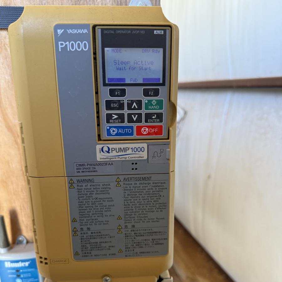 Variable-speed pump drive mounted on a wall